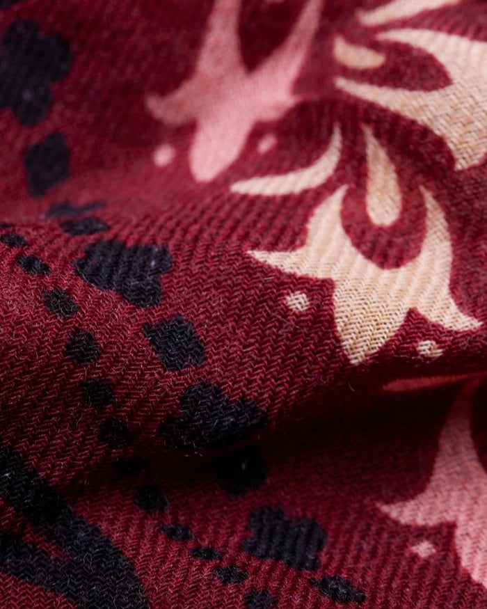 Close-up of the Maison Lecomte Flament Salem scarf’s burgundy and ivory print.