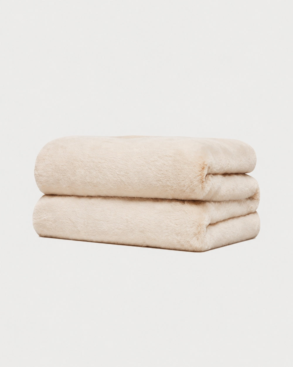 APPARIS Brady Blanket in Latte folded to show its soft double-sided faux fur