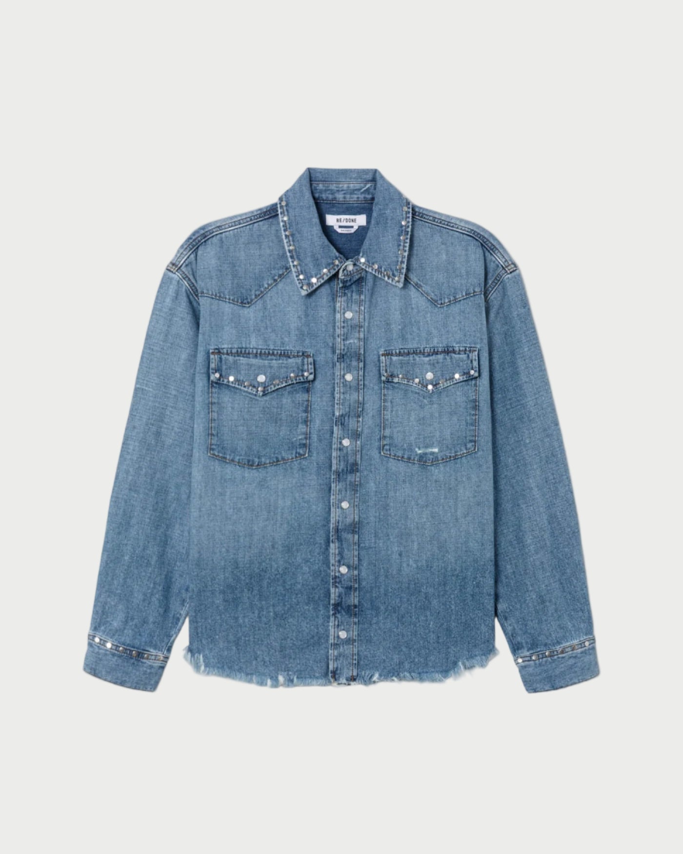 Blue denim shirt on a light gray background
