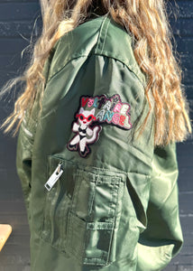 Voltaire angel embroidery on green jacket, available at west2westport.com