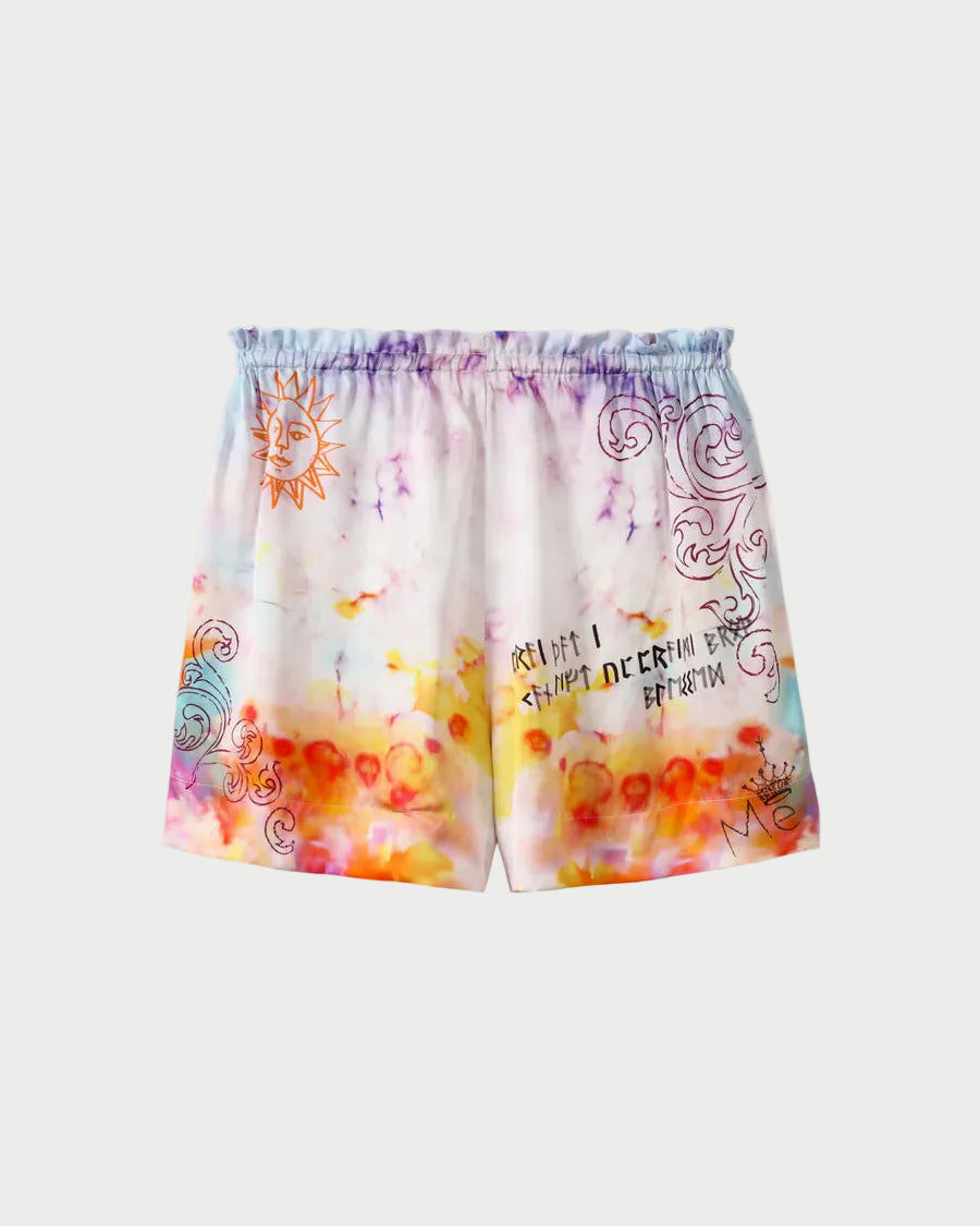 Colorful shorts with abstract patterns on a light gray background