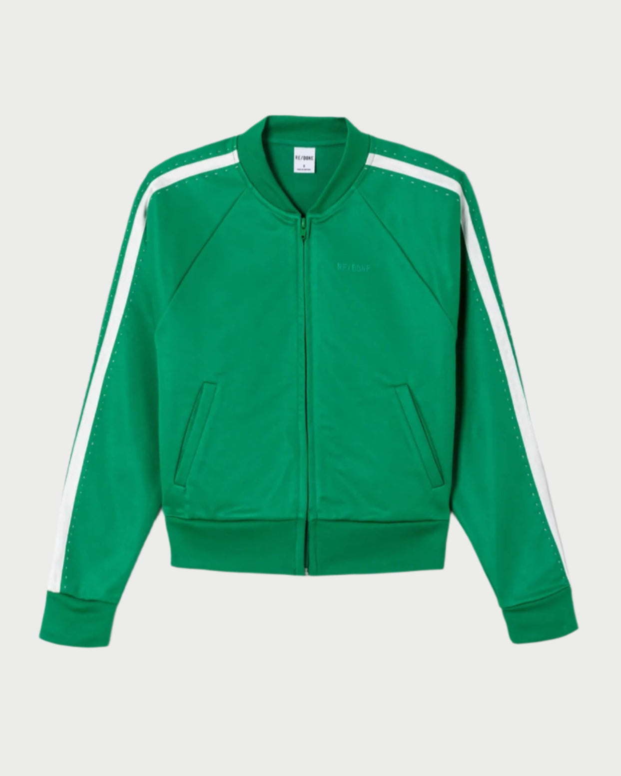 The RE/DONE Sunland Track Jacket is a green jacket with white shoulder and sleeve stripes, inspired by 50s tailoring, featuring two front pockets plus ribbed cuffs and hem for sporty style.