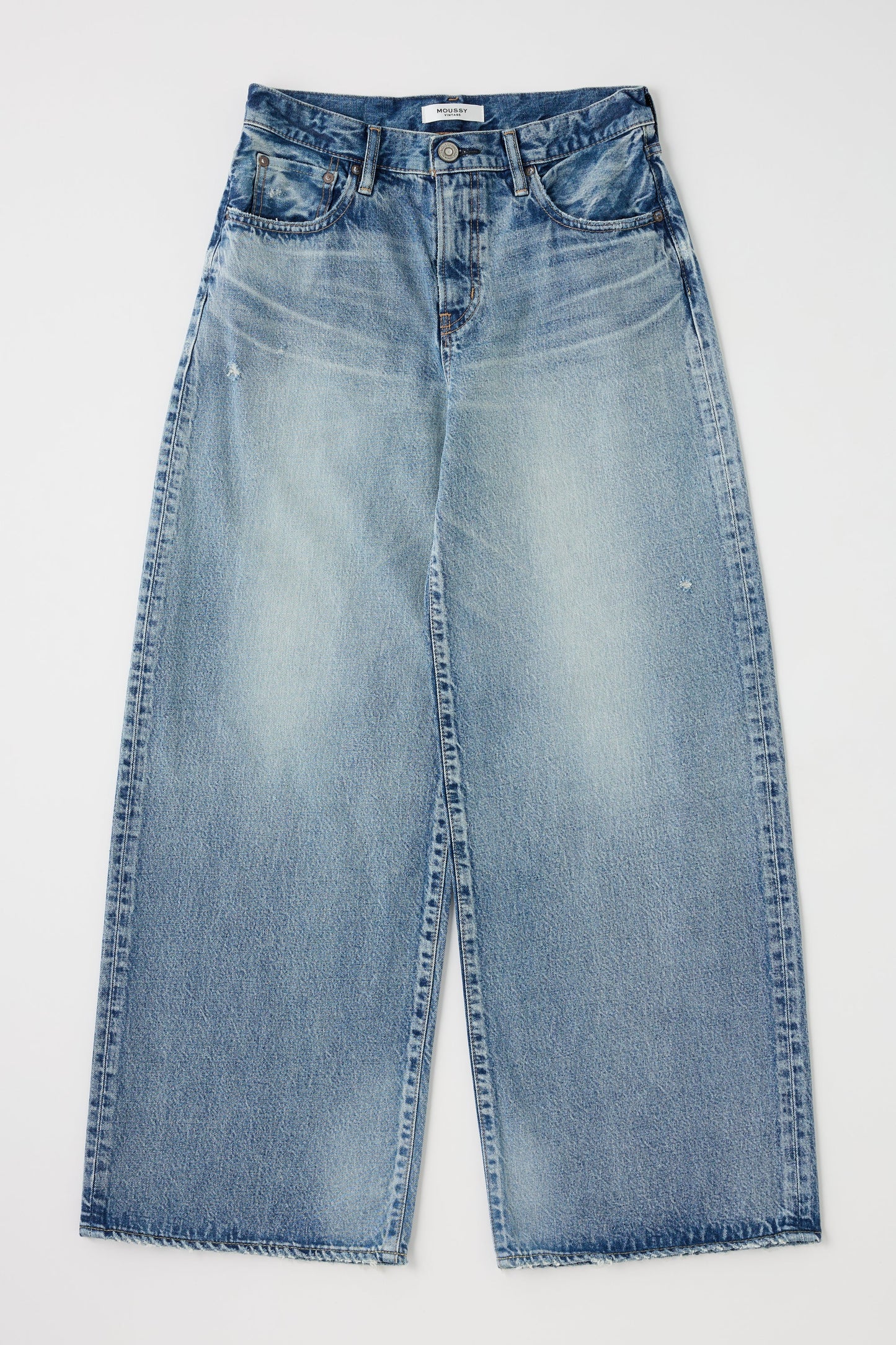The Lewes Super Wide Jeans by Moussy are high-waisted, wide-leg jeans made from Japanese cotton, with a button-zip closure, front and back pockets, and subtle thigh fading. Shown in light blue denim against a white background.