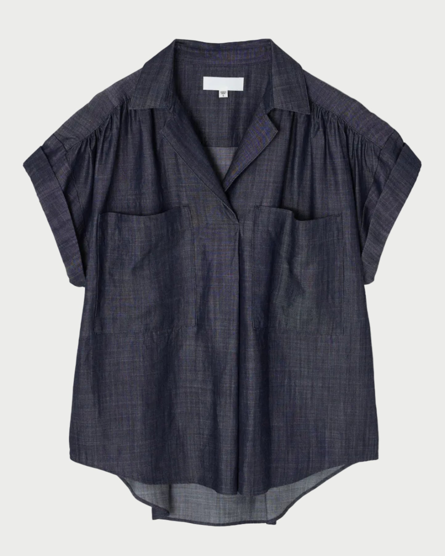 Dark blue shirt on a light gray background