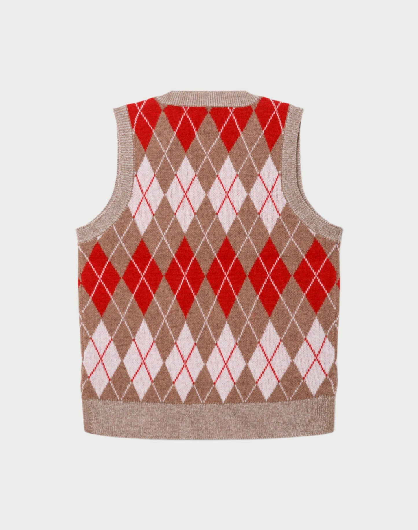 Argyle patterned sweater vest with red and white diamonds on a beige background