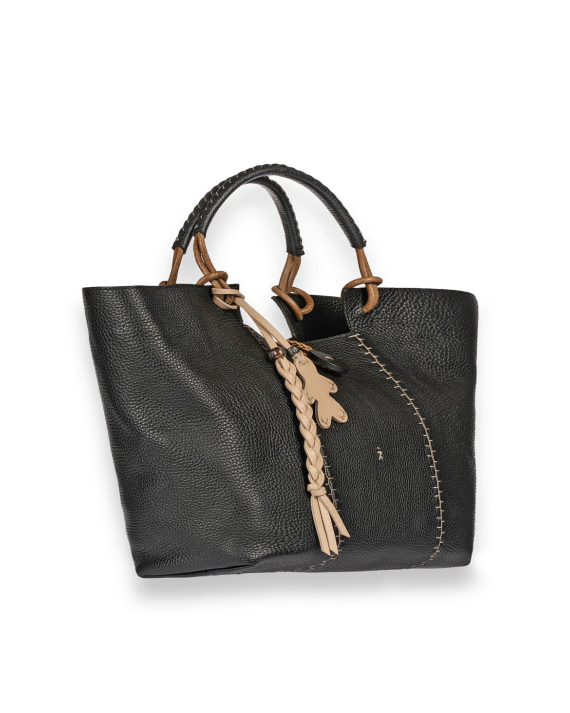 The Medium Muflone Tote by Henry Beguelin is a handmade Italian bag, crafted from black textured calfskin leather with tan stitching and braided accents. It includes dual handles, an adjustable leather shoulder strap, and a decorative charm.