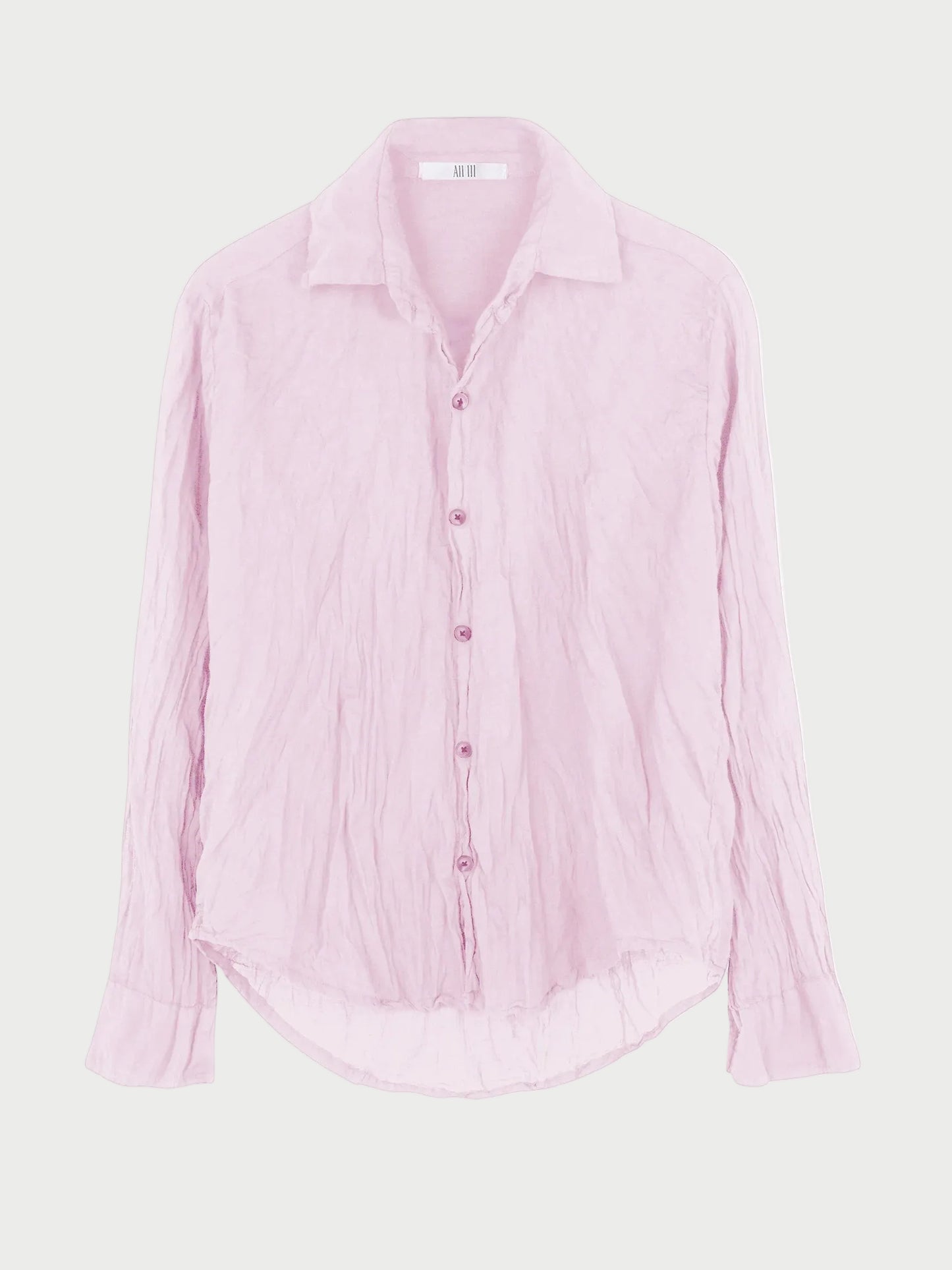 The All III Daniel Button Down by All III is an oversized, light pink cotton gauze shirt featuring long sleeves, a wrinkled texture, pointed collar, and curved hem. Displayed against a plain white background, this button-down offers effortless style and comfort.
