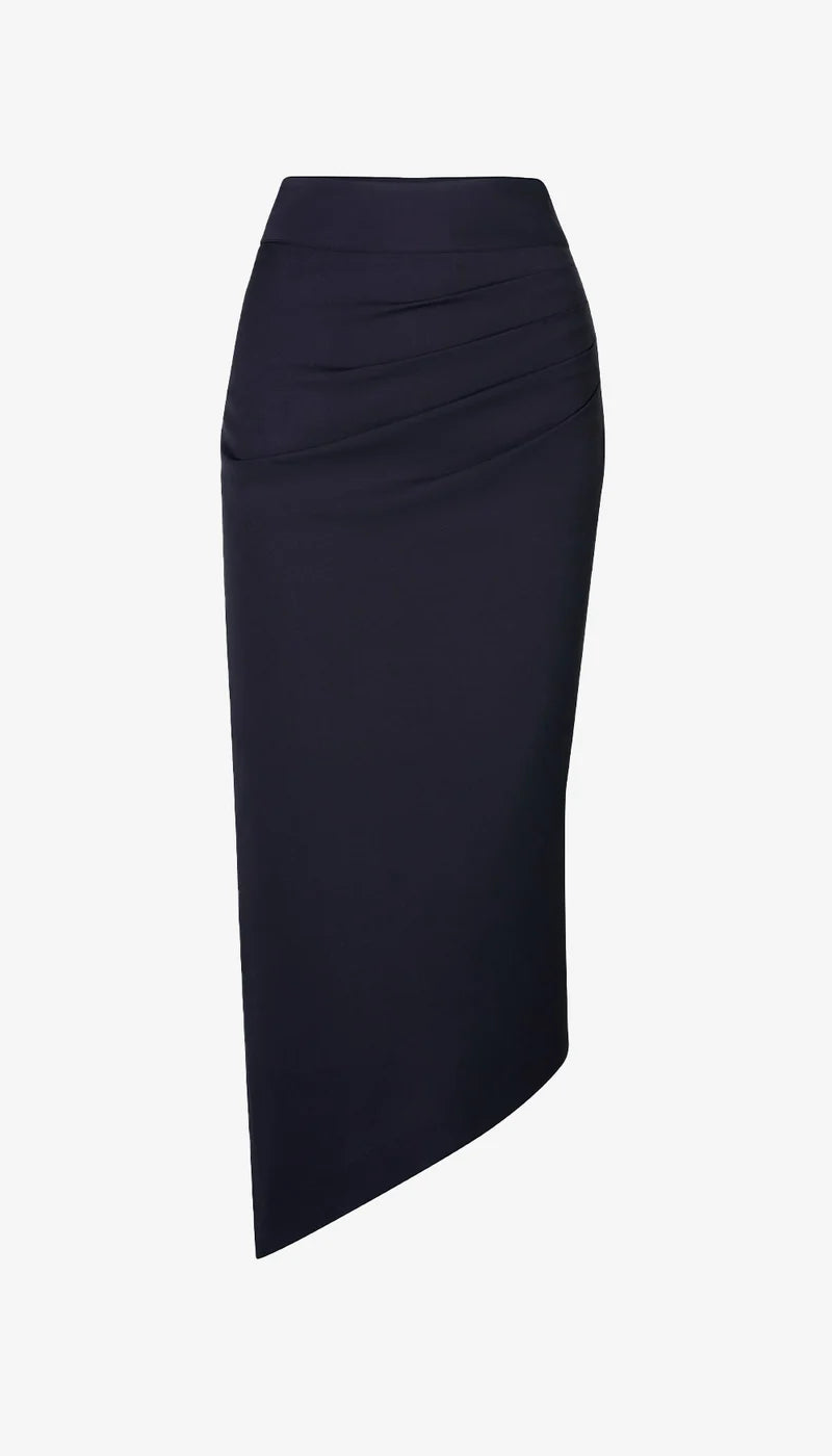 The Smythe Asymmetrical Skirt is a black, high-waisted pencil skirt with ruched hip detail and an asymmetrical hem, shown against a white background.