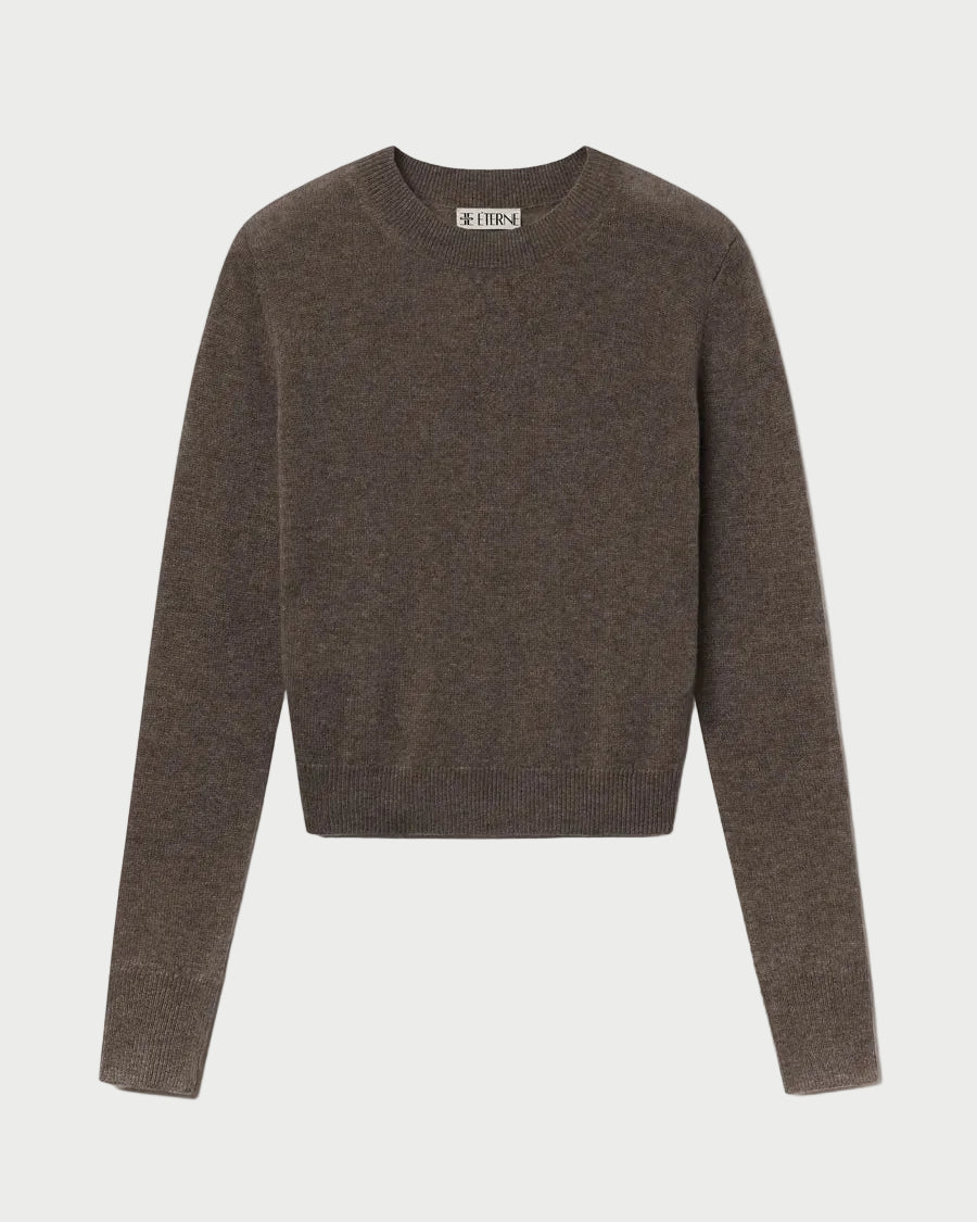 The ÉTERNE Francis Sweater by Eterne is a brown, slim-fit crewneck with long sleeves, shown laid flat on a white background.