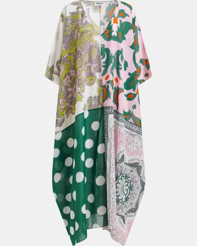 The Hansas Printed Caftan by Essentiel Antwerp is a loose, oversized style with a deep V-neck, showcasing patchwork florals, pink and green abstract shapes, large white polka dots on green, and bold black-and-white paisley prints.