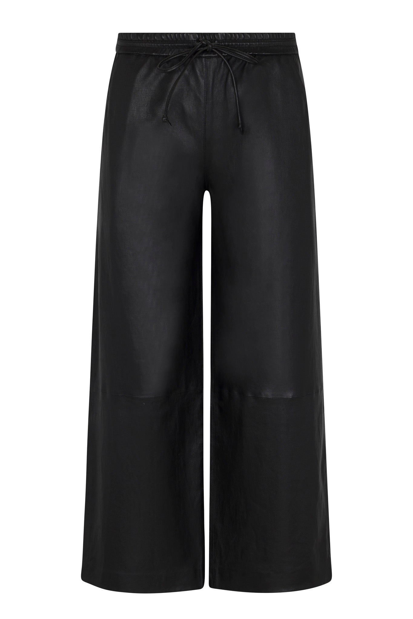 SPRWMN Cropped Leather Baggy Pants by SPRWMN are black wide-leg track pants with a shiny finish, drawstring waistband, relaxed fit, and a sleek, modern look—no visible pockets or embellishments.