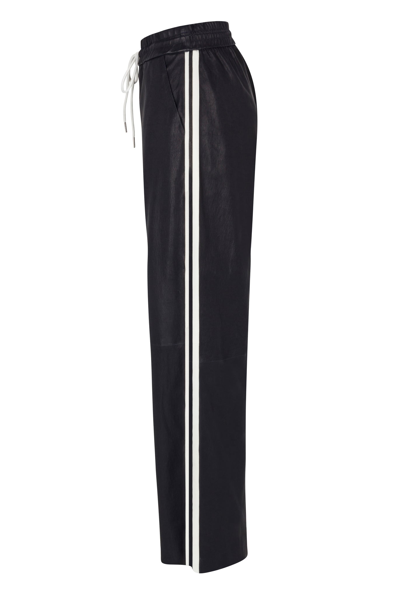 The SPRWMN Baggy Athletic Pants feature black wide-leg styling, an elastic waistband with white drawstring, vertical white side stripes, and side pockets. A relaxed fit adds a modern twist inspired by classic black leather baggy pants.