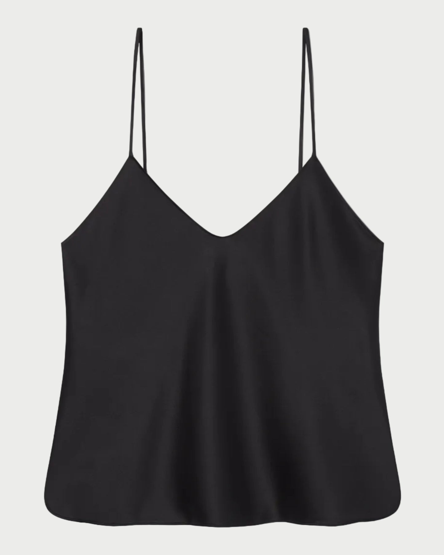 Black slip top with thin straps on a white background