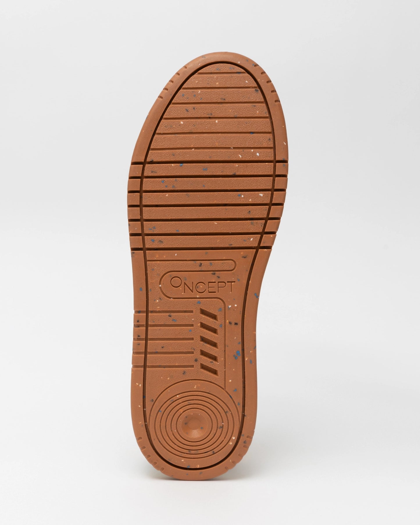 The Panama Sneaker from Oncept boasts a brown design with a sole featuring speckled details and various grooves, ensuring both comfort and style. "ONCEPT" is embossed near the heel, complemented by circular and linear patterns for optimal grip.
