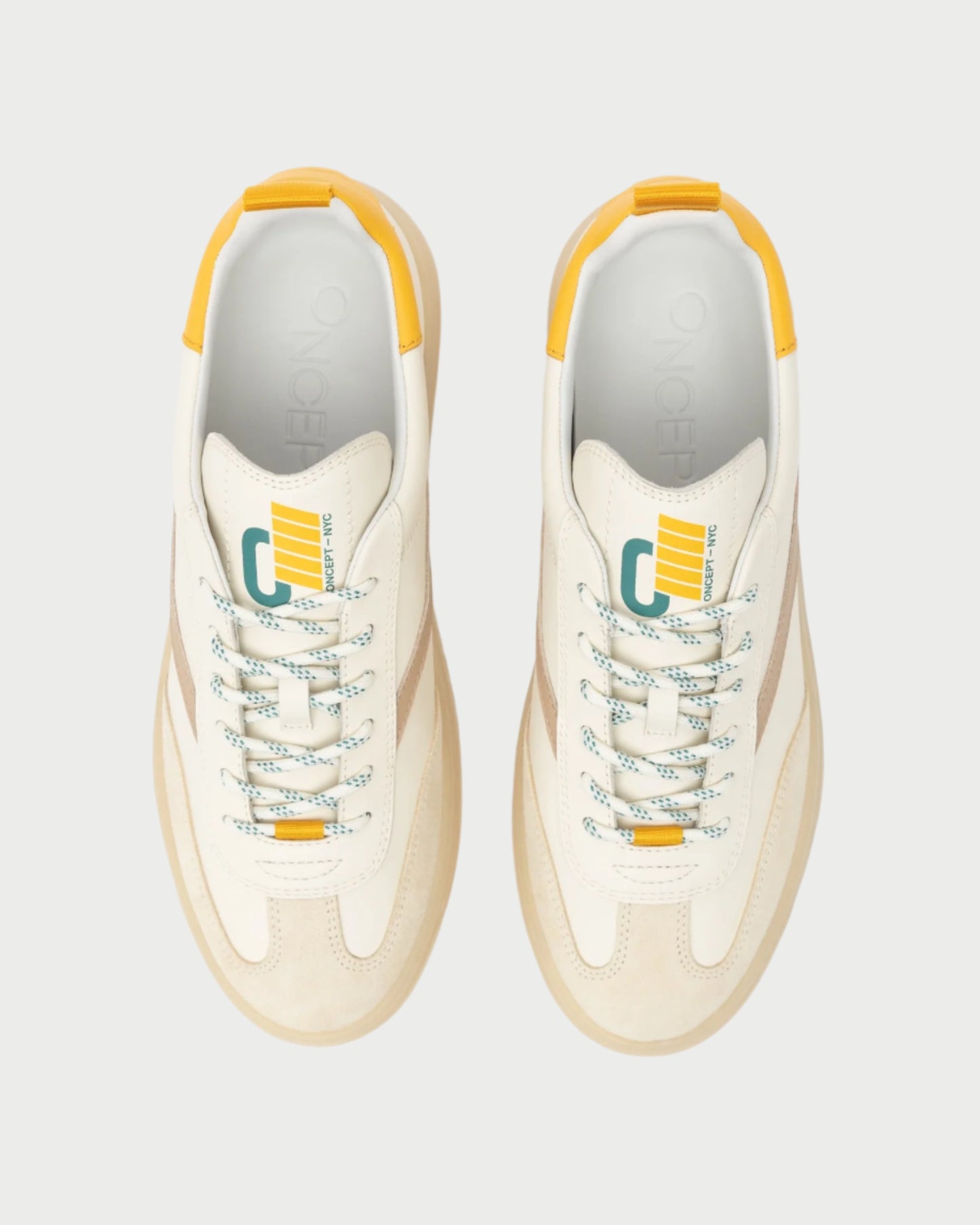 Top view of a pair of Oncept Panama Sneakers in beige, featuring multicolored laces and accents in yellow, green, and teal. These sneakers offer decorative side stripes and a stylized "O" logo on the tongue for added flair.