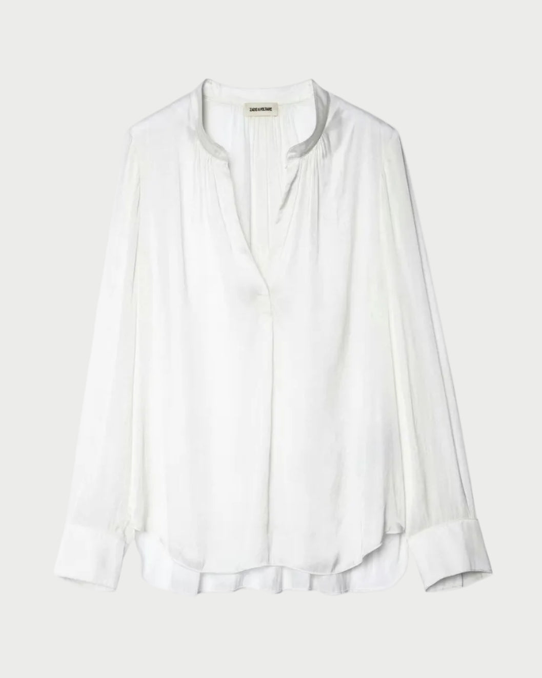 White blouse on a light gray background