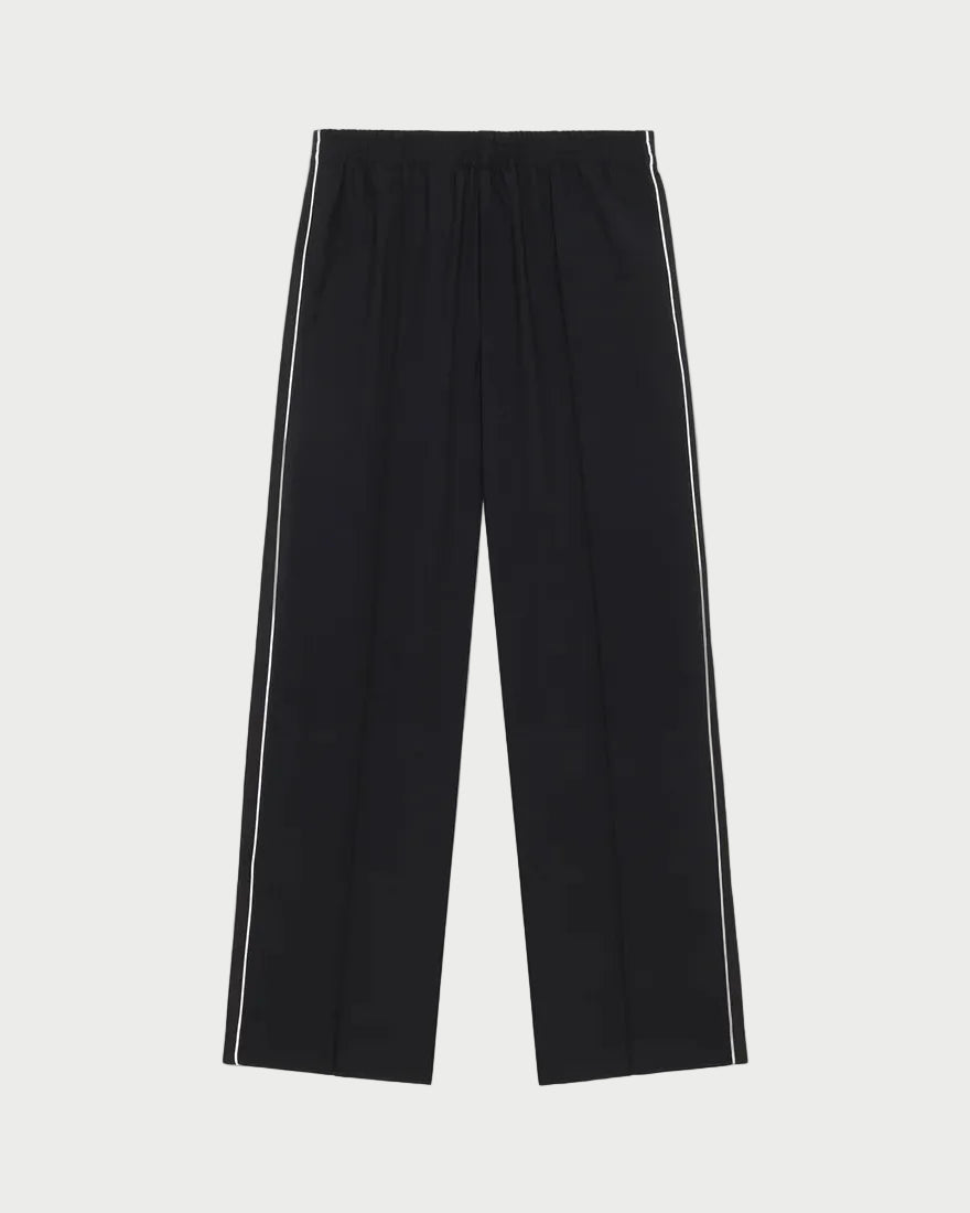 Black wide-leg cropped pants with white double stripes down the sides, shown flat against a light gray background.