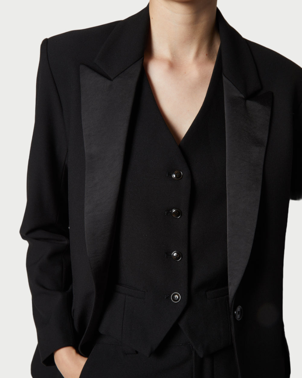 Black suit with a white background