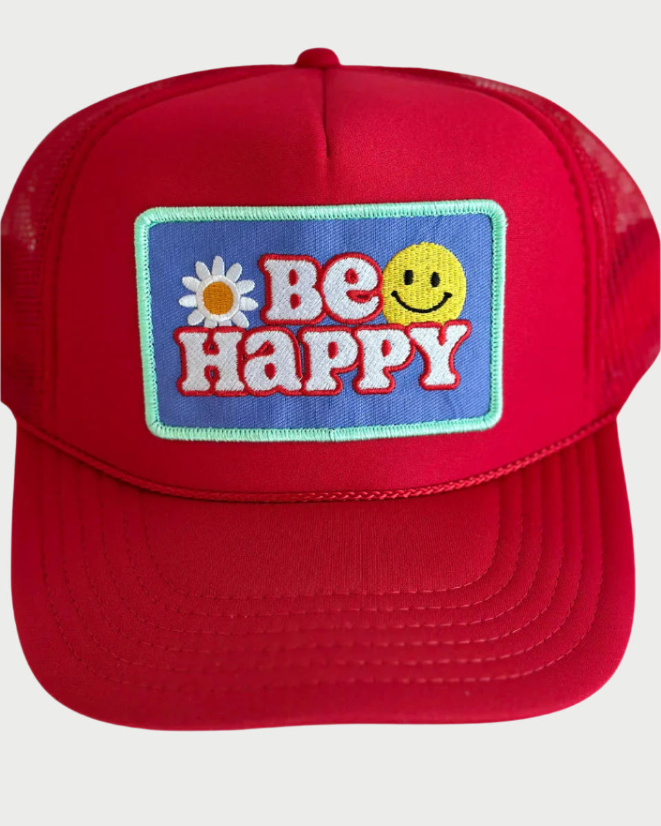 The Be Happy Trucker Hat from LOCAL BEACH showcases a vibrant red design with "BE HAPPY" on a blue patch, featuring a daisy as the "E" and a smiley face as the "P," all bordered in light green. Ideal for sunny beach days!.