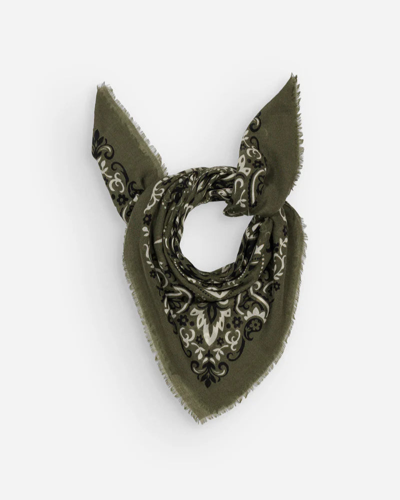Maison Lecomte Flament Bandana Scarf Khaki in cotton voile with a black and white paisley pattern, folded into a triangle and tied loosely, frayed edges visible against a plain white background.
