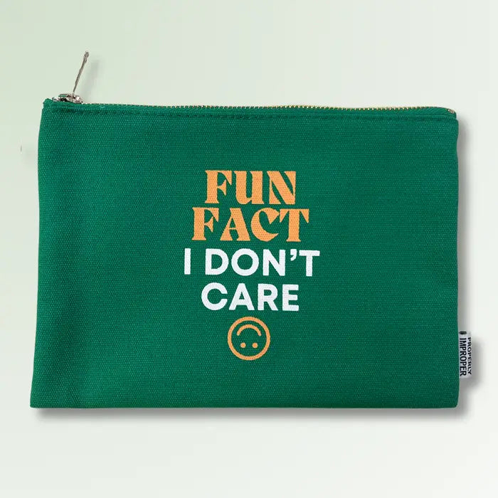 The Properly Improper's "Improper Pouches" is a durable green zippered pouch with "FUN FACT I DON'T CARE" in bold and a small sad face emoticon below. It includes a convenient side tag, making it an ideal quirky gift.