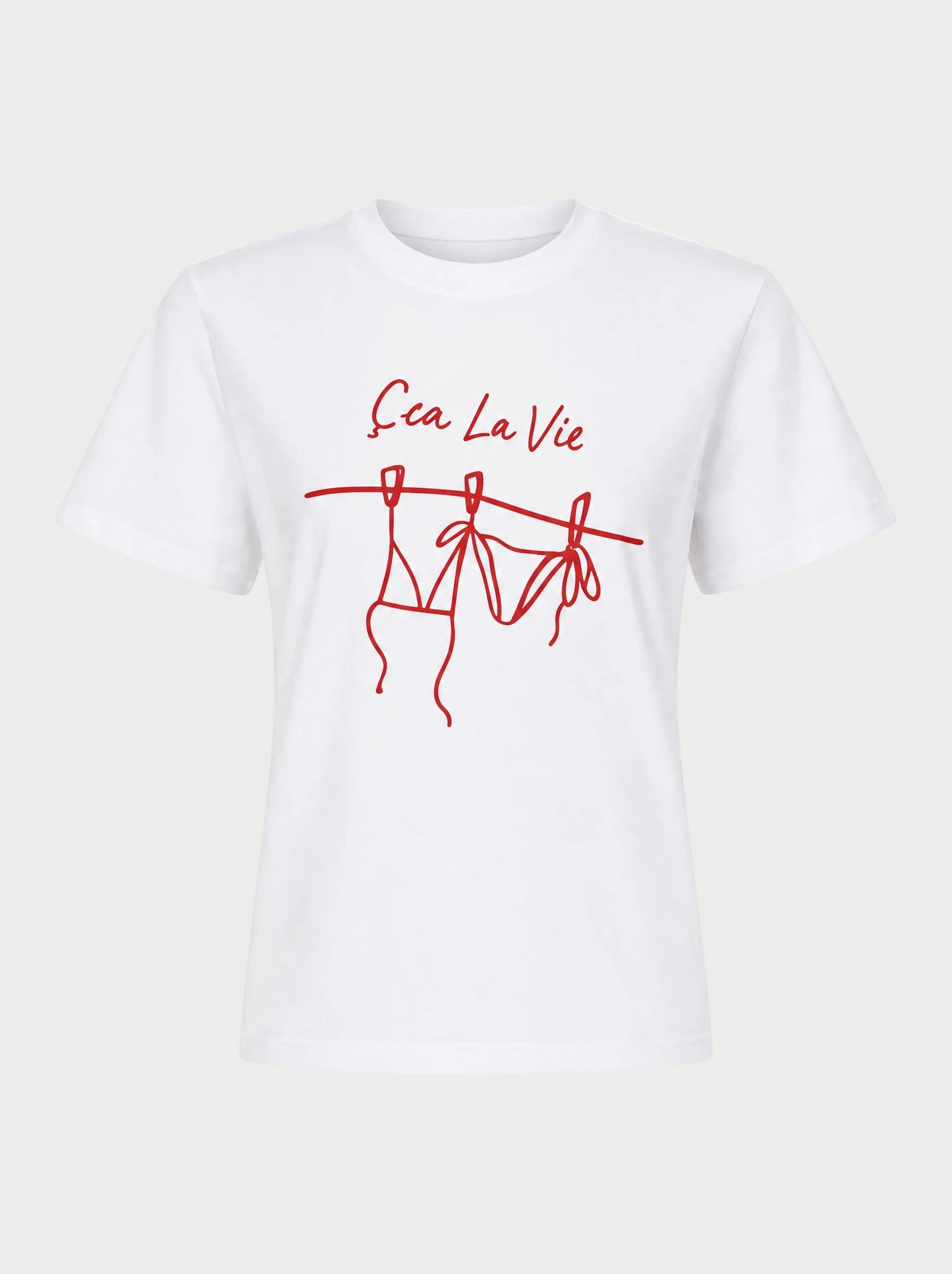 The Sunny Somewhere Sea La Vie Tee by Sunny Somewhere features red "Ça La Vie" text above a bikini line drawing on a white, lightweight crew neck tee with short sleeves and a relaxed fit—perfect for laid-back summer days.