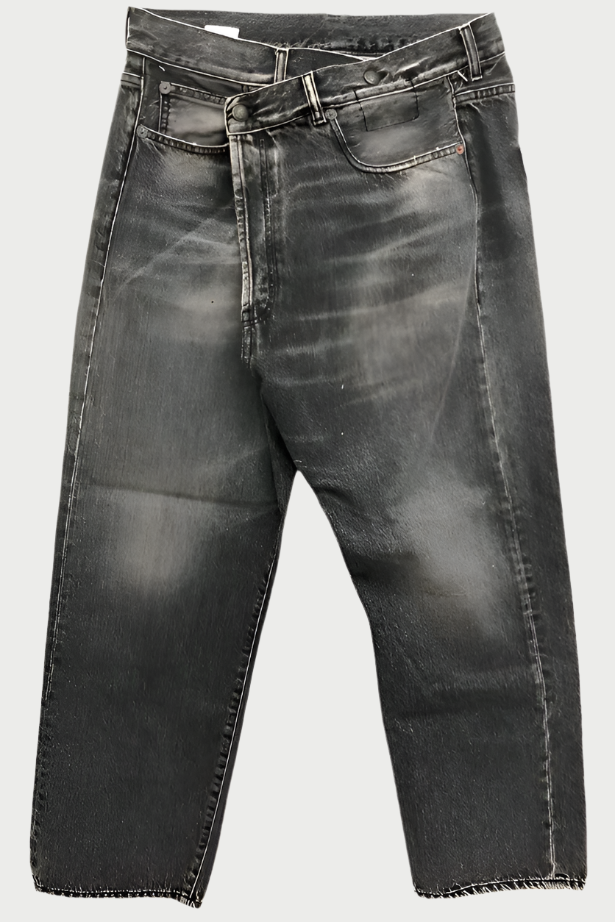 A pair of black washed R13 Crossover Jean in Leyton Black by R13 with a high waist, button fly, and front and back pockets. The jeans feature a slightly faded effect on the thighs and knees, giving them the coolest worn-in look. They are laid flat against a white background. Size down for the perfect fit.
