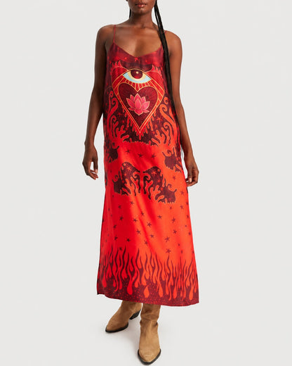 A red ME369 Olivia Camisole Dress cut on the bias, featuring a graphic print of a stylized eye, a lotus flower, stars, and flames.