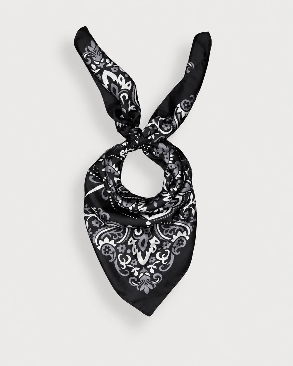 Maison Lecomte Flament Black silk bandana scarf tied in a knot on a white background.