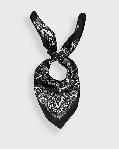 Maison Lecomte Flament Black silk bandana scarf tied in a knot on a white background.