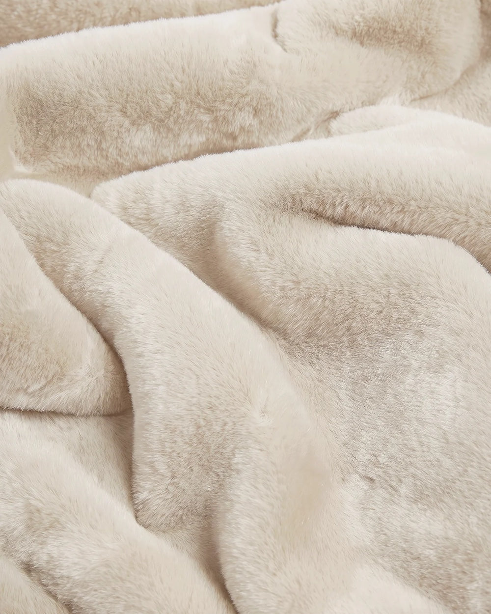 Close-up of APPARIS Brady Blanket in Latte showing its plush faux fur texture