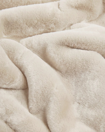 Close-up of APPARIS Brady Blanket in Latte showing its plush faux fur texture