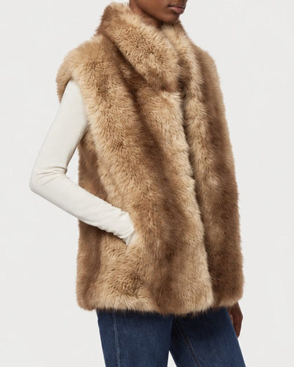 Side view of APPARIS Laila Vest in Blonde Mink layered over a cream top