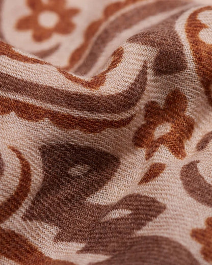 Close-up of the Maison Lecomte Flament Cashew scarf’s cream and brown bandana print.
