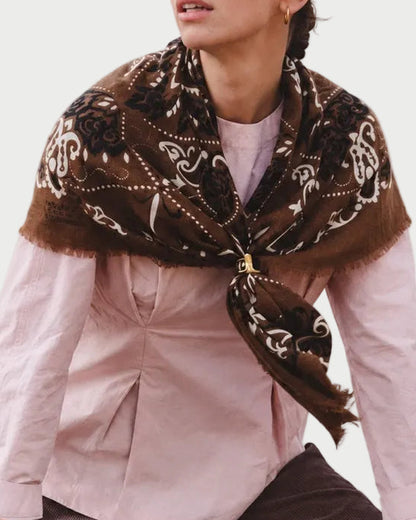 Maison Lecomte Flament Hazelnut scarf worn over a pale pink shirt.