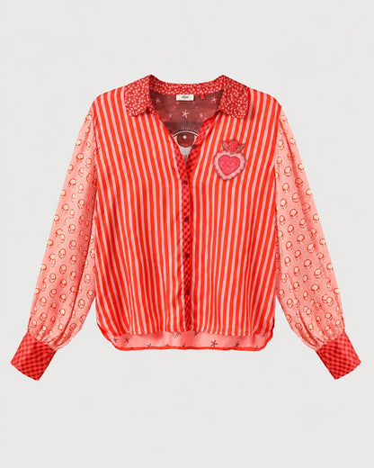 ME369 Sola Puff Sleeve Blouse Red Aura featuring red vertical stripes, balloon sleeves with an alien-face print, and a pink heart patch on the chest.