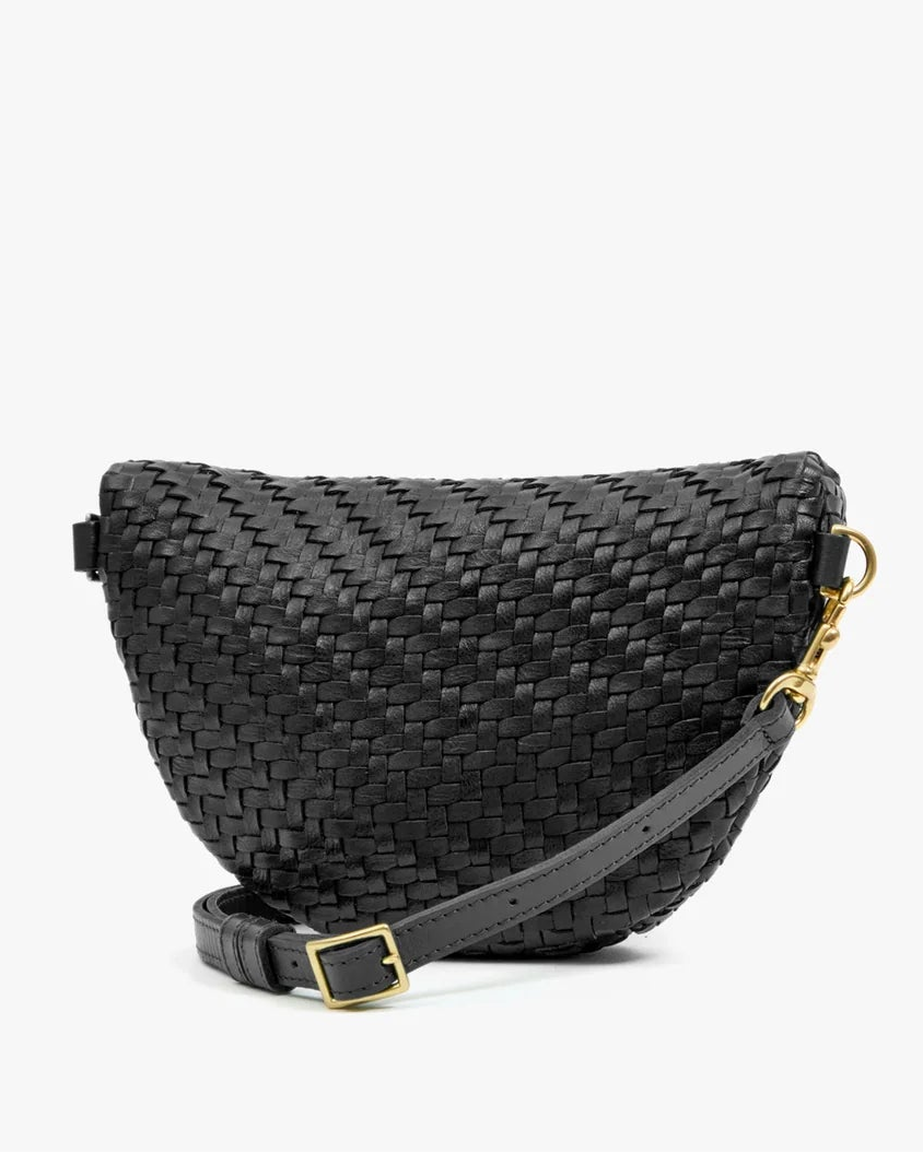 Black woven crescent-shaped Clare V. Petite Fanny Black with an adjustable strap and gold hardware.