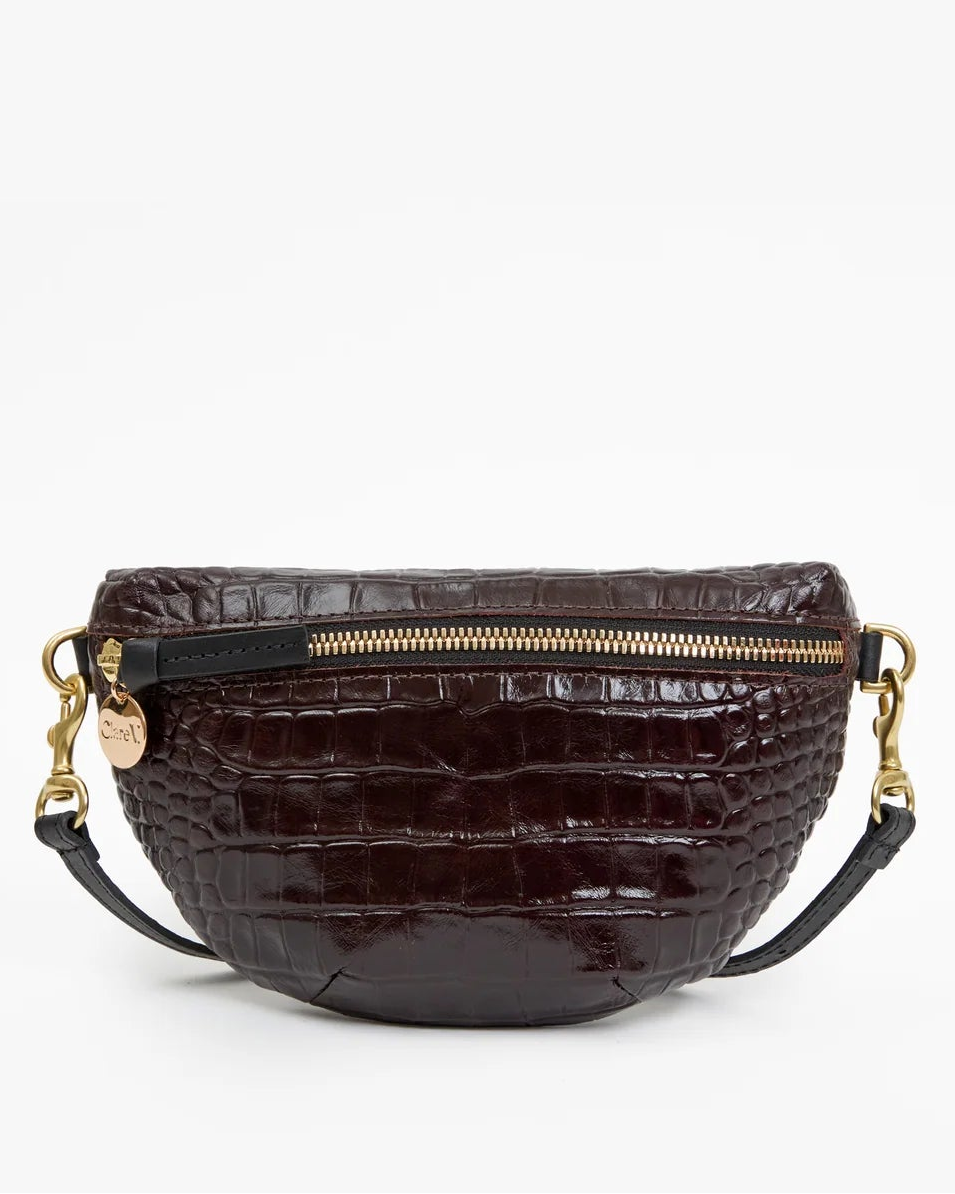 Clare V. Petite Fanny Mahogany crescent-shaped belt bag in dark brown croco-embossed leather, featuring a gold zipper and black leather straps with gold hardware.
