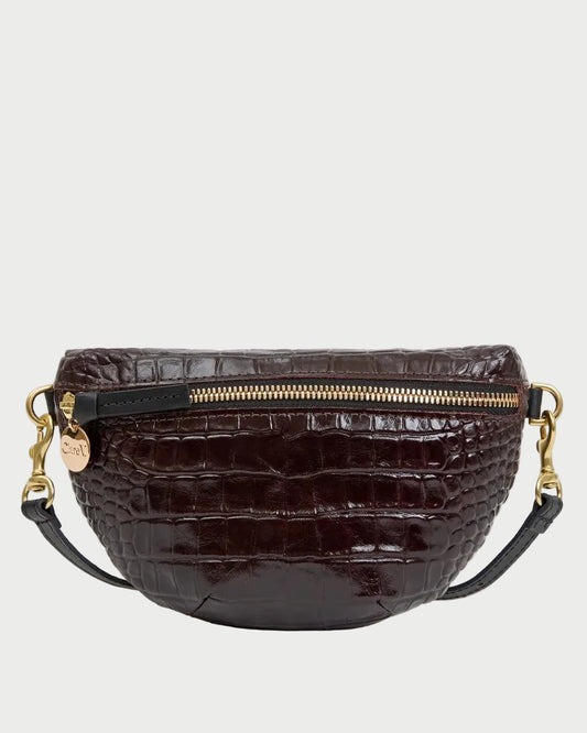 Clare V. Petite Fanny Mahogany crescent-shaped belt bag in dark brown croco-embossed leather, featuring a gold zipper and black leather straps with gold hardware.