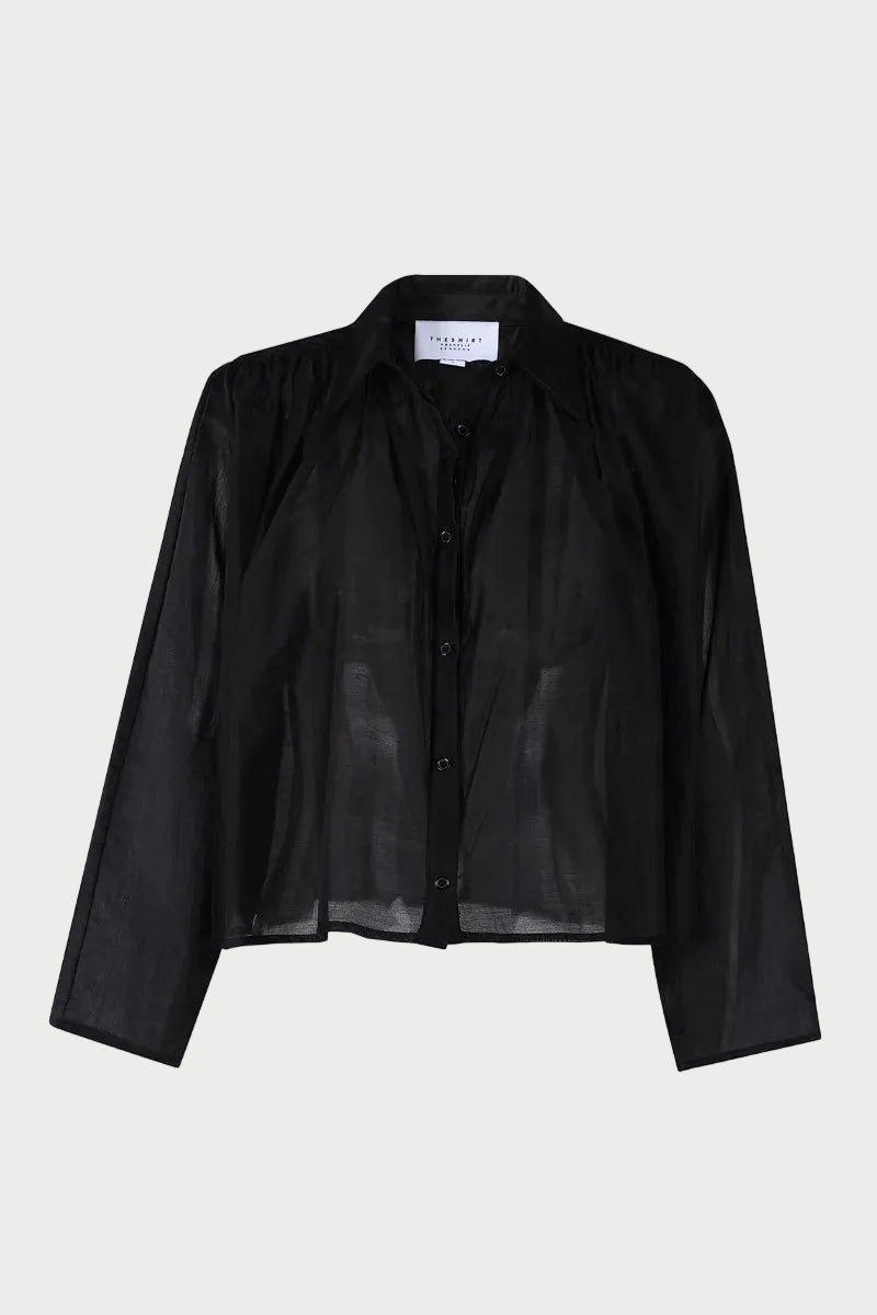 The Shirt Hayden Shirt Black is a sheer black cropped button-up shirt with a pointed collar and a swing silhouette.