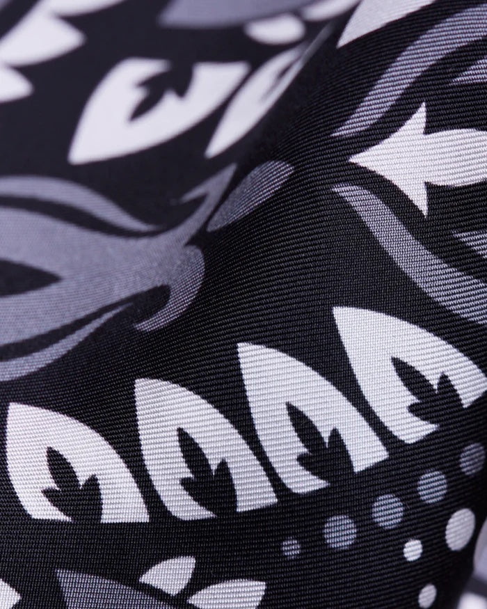 Close-up of the Maison Lecomte Flament Black scarf’s black and ivory bandana print.