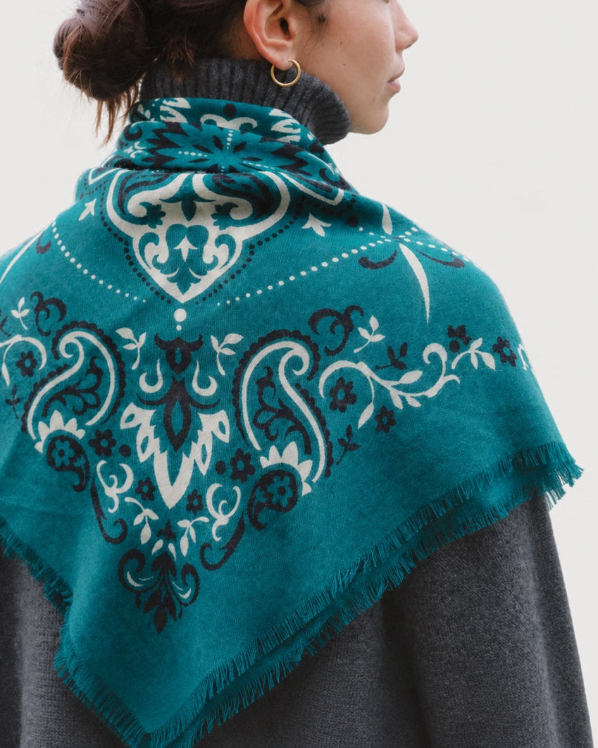 Rear view of the Maison Lecomte Flament Petrol scarf draped over a dark sweater.