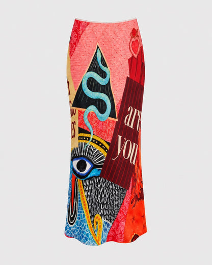 ME369 Blakely Slip Skirt Red Aura, a maxi skirt featuring a vibrant, multicolored graphic print with abstract patterns, a large eye, and text that reads “are you.”