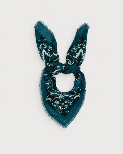 Maison Lecomte Flament Petrol bandana scarf tied in a knot on a white background.