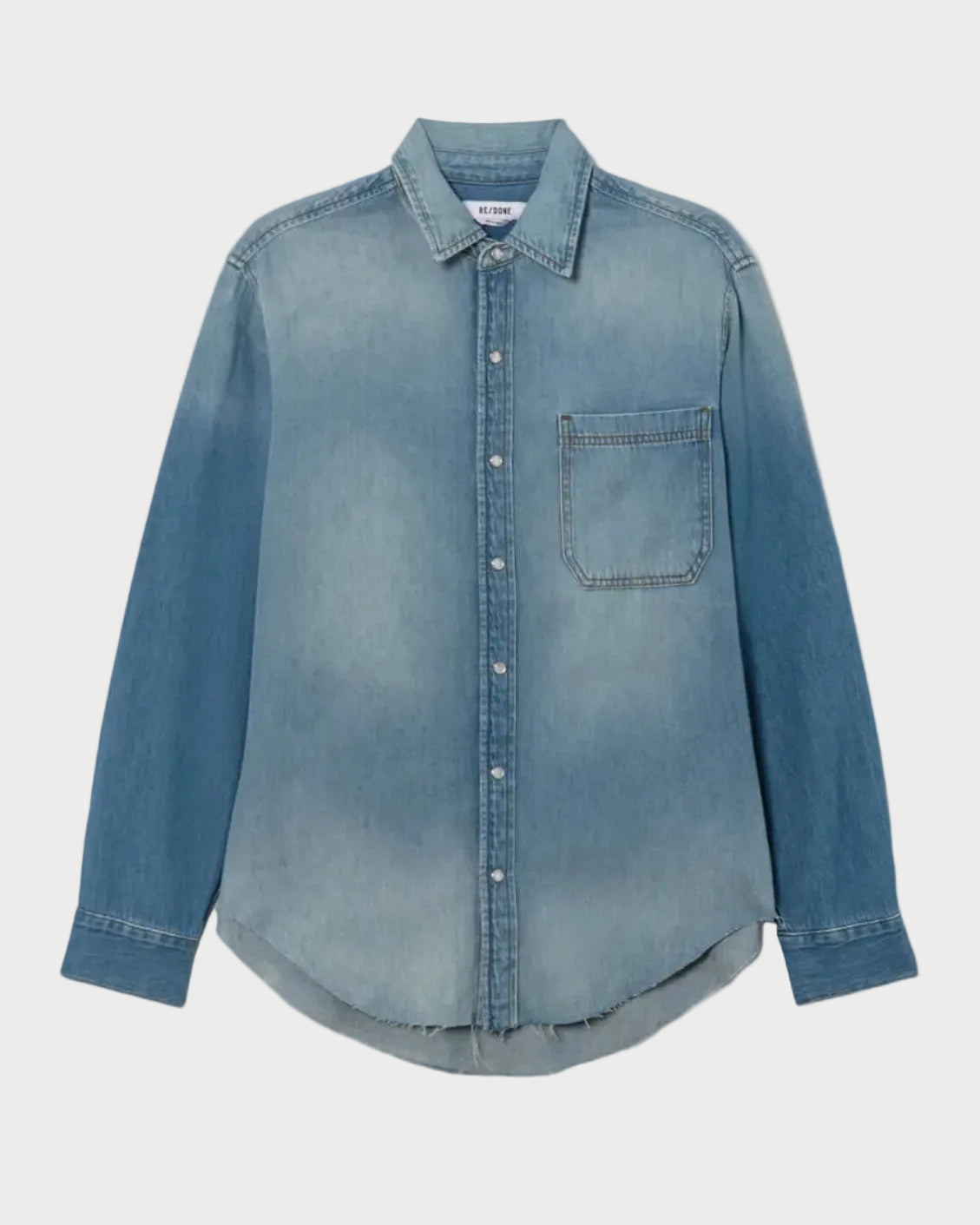 Blue denim shirt on a light gray background