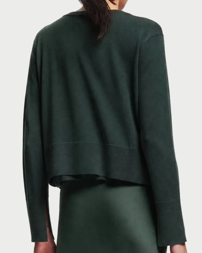 Back view of a lightweight dark green Saint Art Elodie Sweater featuring a crew neckline and a wide ribbed hem.