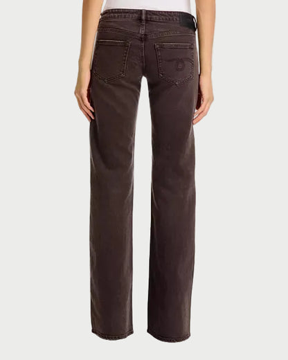Rear view of a person wearing dark brown wide-leg jeans against a plain white background.