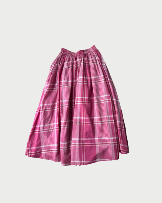 The 166 Plaid Skirt by A Friend Made is a pre-loved pink plaid midi skirt with an elastic waistband and gathered 100% cotton fabric, shown against a plain light gray background.