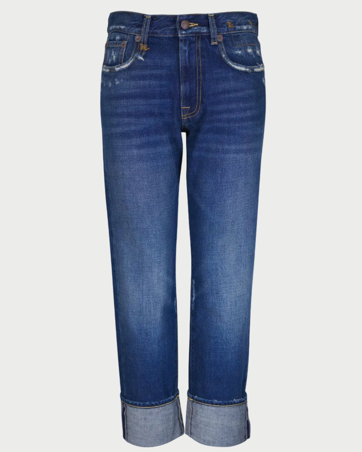 The R13 Cuffed Romeo Jean in Oasis Blue features a slim boyfriend fit, subtle fading, and light distressing near the pockets. Shown against a white background.