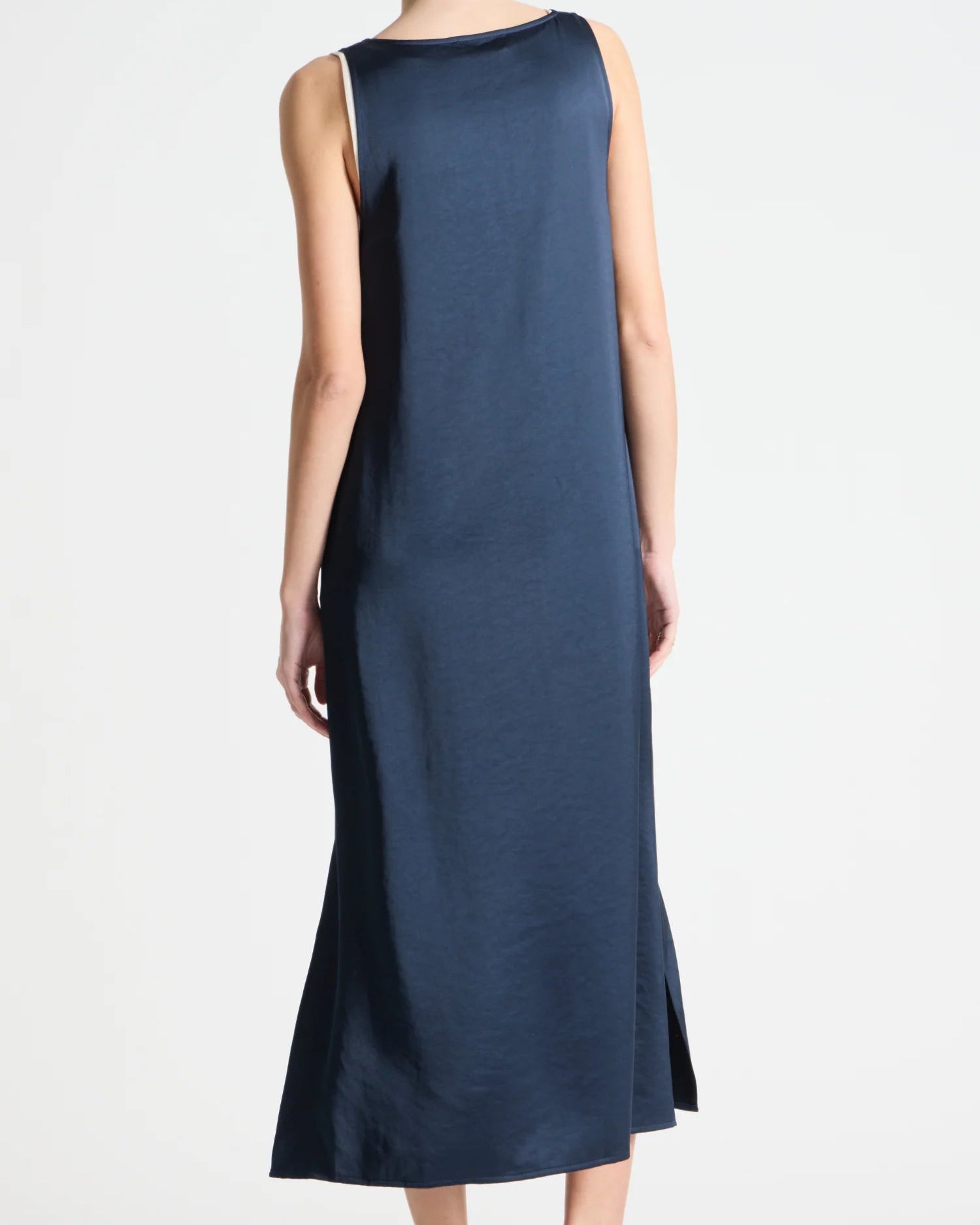 Navy sleeveless dress worn by a person on a white background
